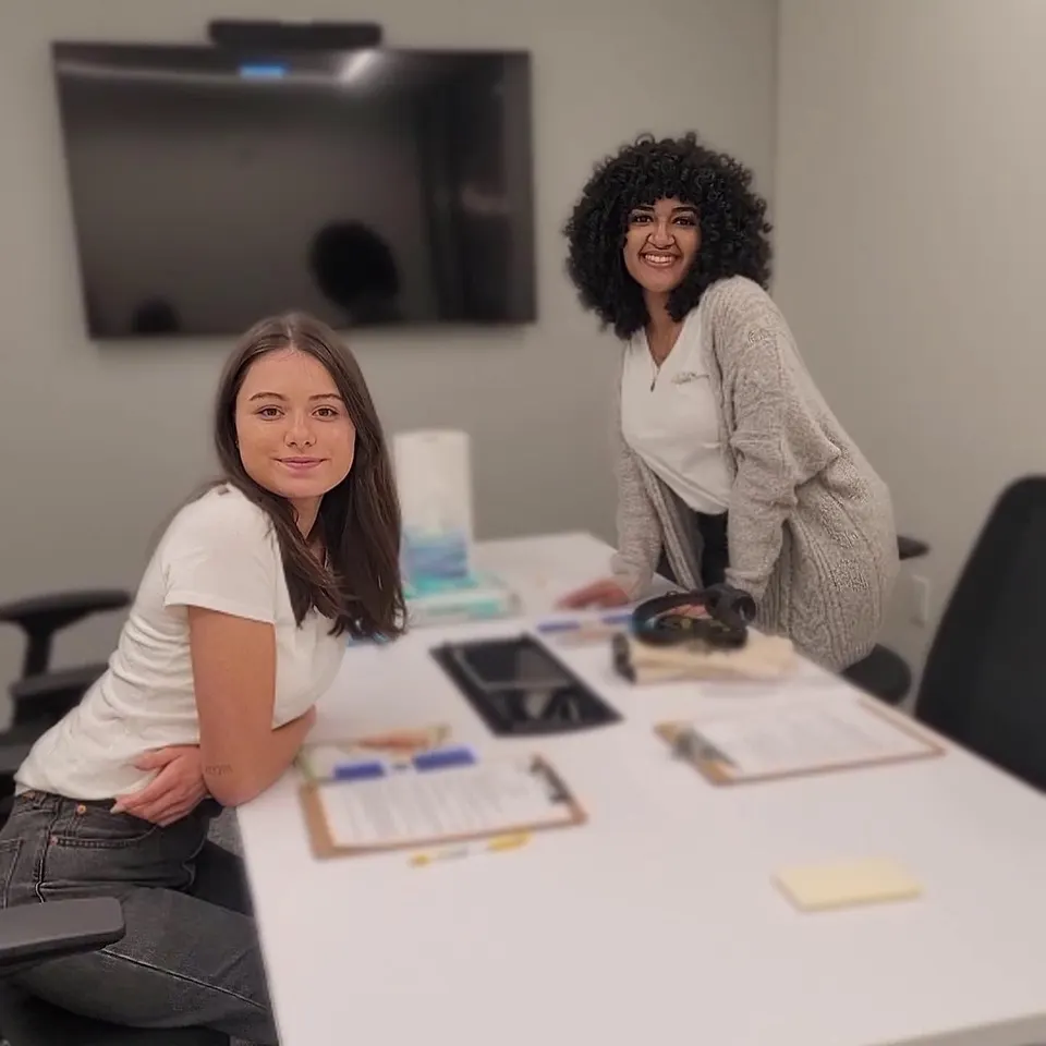 Two Act Now Foundation interns guiding visitors through a virtual dementia tour