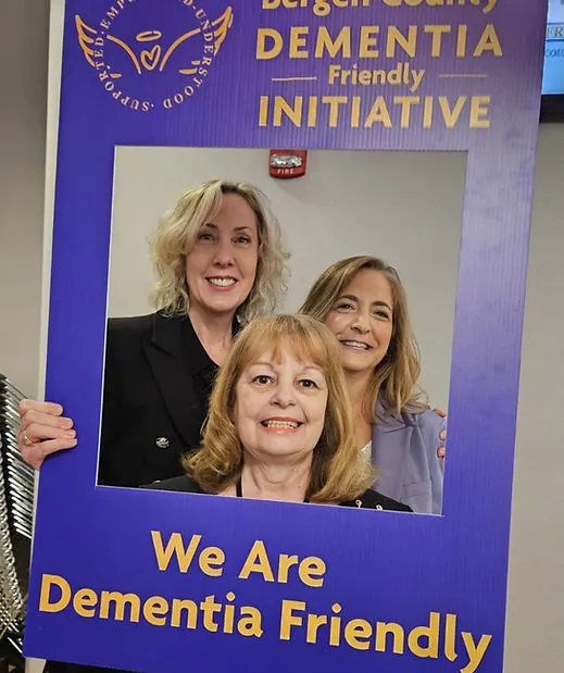 Leaders and organizers at the Bergen County Dementia Friendly Initiative kickoff event posing for a photo call